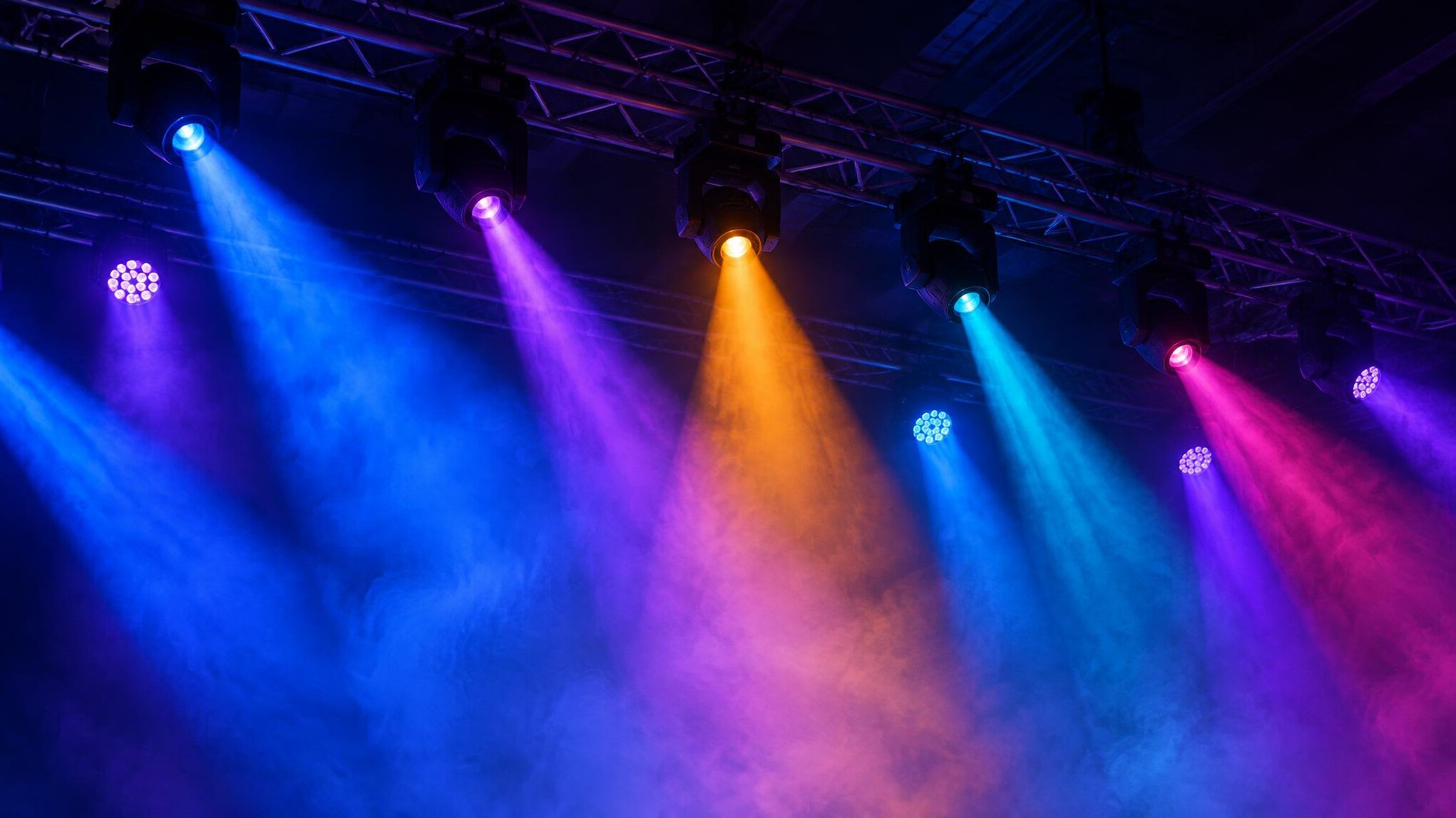 Stage lighting rig with several coloured beams